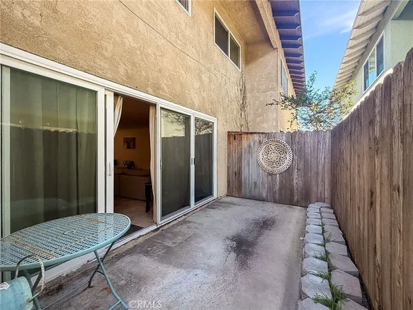 a balcony view with a backyard space
