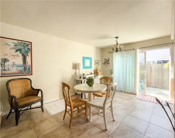 a living room with furniture and stairs