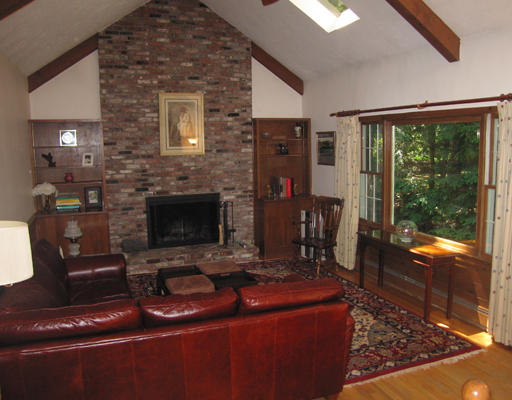 37 Greenwood Road Wellesley, MA 02481 - Photo 6 of 15 a living room with furniture a floor to ceiling window and a flat screen tv