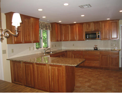 37 Greenwood Road Wellesley, MA 02481 - Photo 8 of 15 a kitchen with a sink a microwave and cabinets