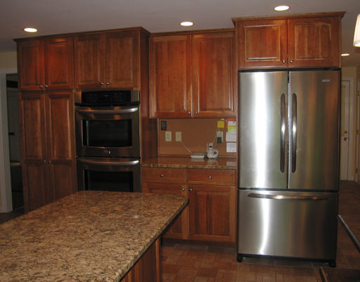 37 Greenwood Road Wellesley, MA 02481 - Photo 9 of 15 a kitchen with kitchen island a refrigerator and a sink
