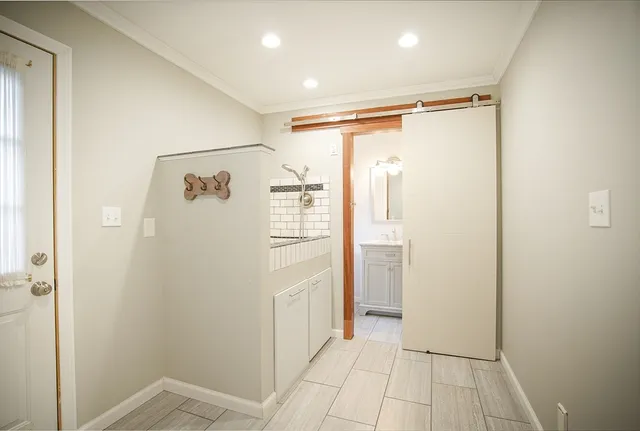 a view of an empty room with a window