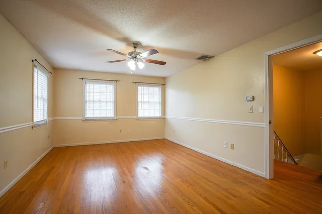 a bathroom with a granite countertop sink and a shower