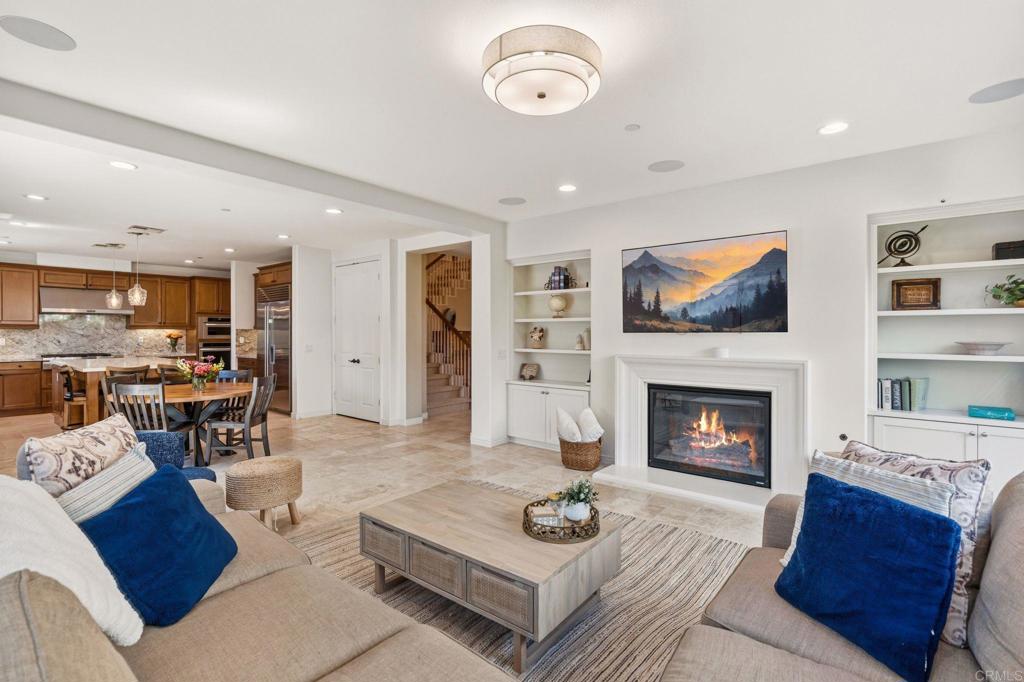 809 Dolphin Circle Encinitas, CA 92024 - Photo 25 of 71 a living room with furniture and a fireplace