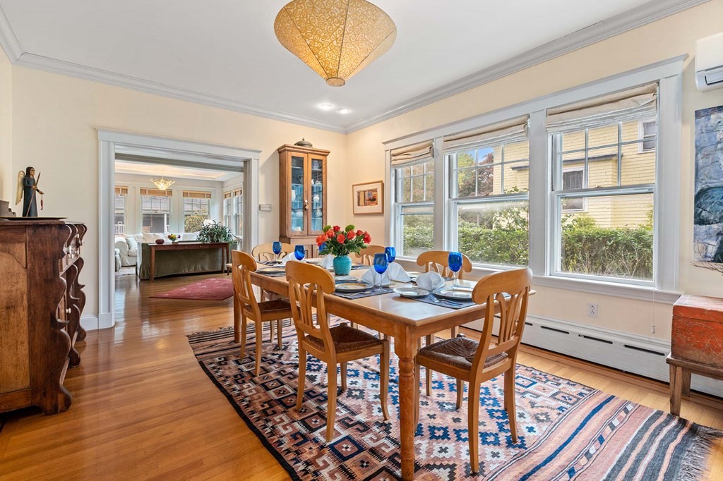 47 Stearns Street Newton, MA 02459 - Photo 11 of 32 a view of a dining room with furniture window and wooden floor