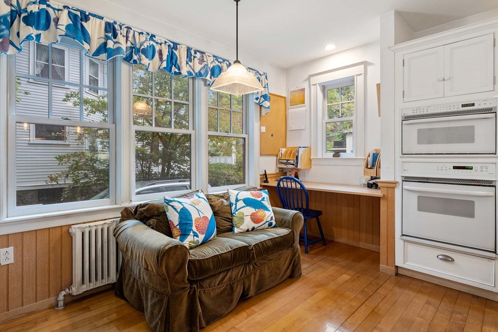 47 Stearns Street Newton, MA 02459 - Photo 17 of 32 a living room with furniture and large windows