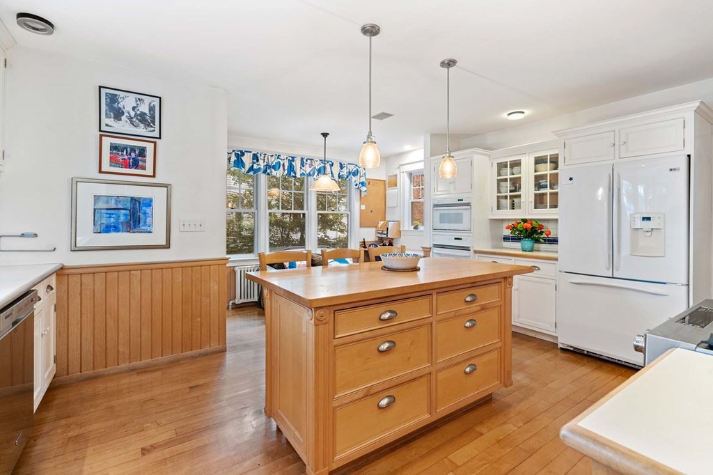 47 Stearns Street Newton, MA 02459 - Photo 19 of 32 a kitchen with a sink stove and cabinets