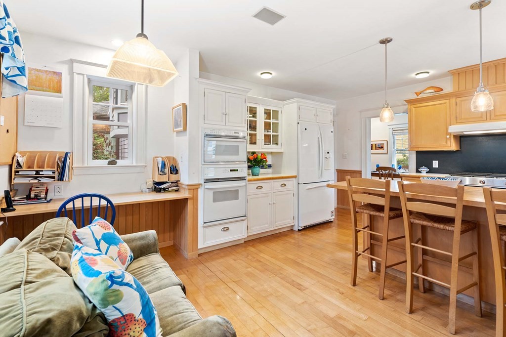 47 Stearns Street Newton, MA 02459 - Photo 20 of 32 a kitchen that has a lot of furniture a sink a window and stainless steel appliances