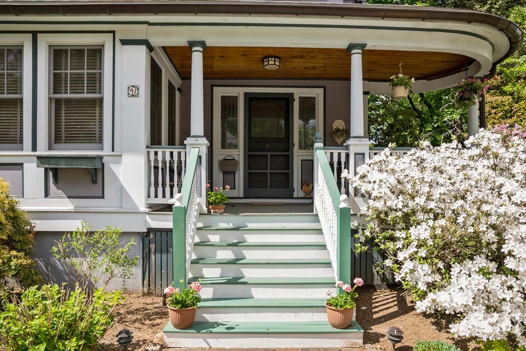 47 Stearns Street Newton, MA 02459 - Photo 2 of 32 a front view of a house with a garden