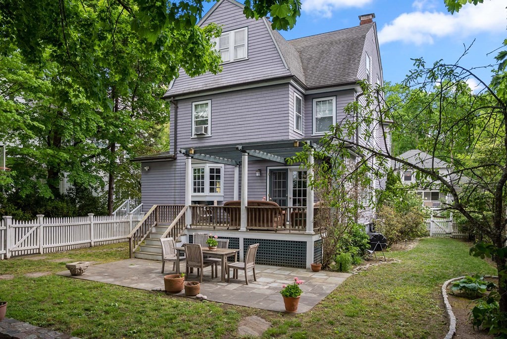 47 Stearns Street Newton, MA 02459 - Photo 25 of 32 a view of a house with backyard sitting area and garden