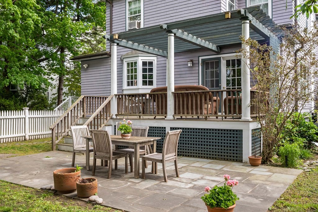 47 Stearns Street Newton, MA 02459 - Photo 26 of 32 a view of a house with a chairs and table in a patio
