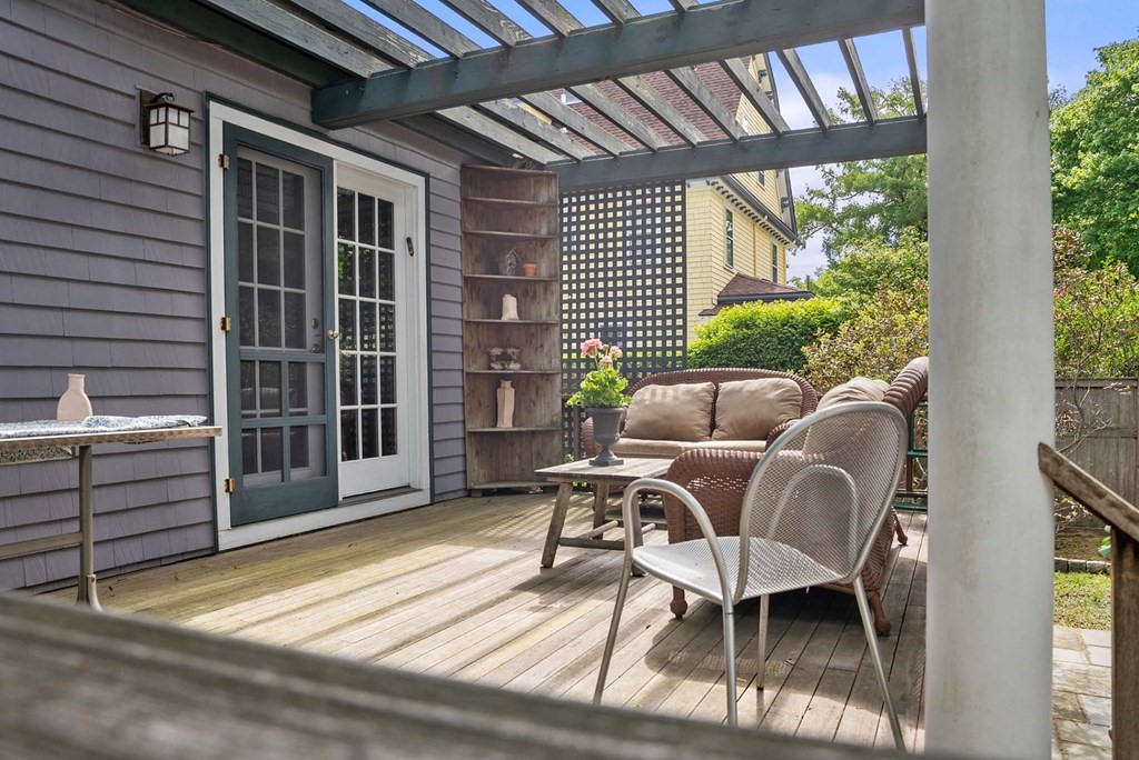 47 Stearns Street Newton, MA 02459 - Photo 27 of 32 a balcony with furniture and a potted plant