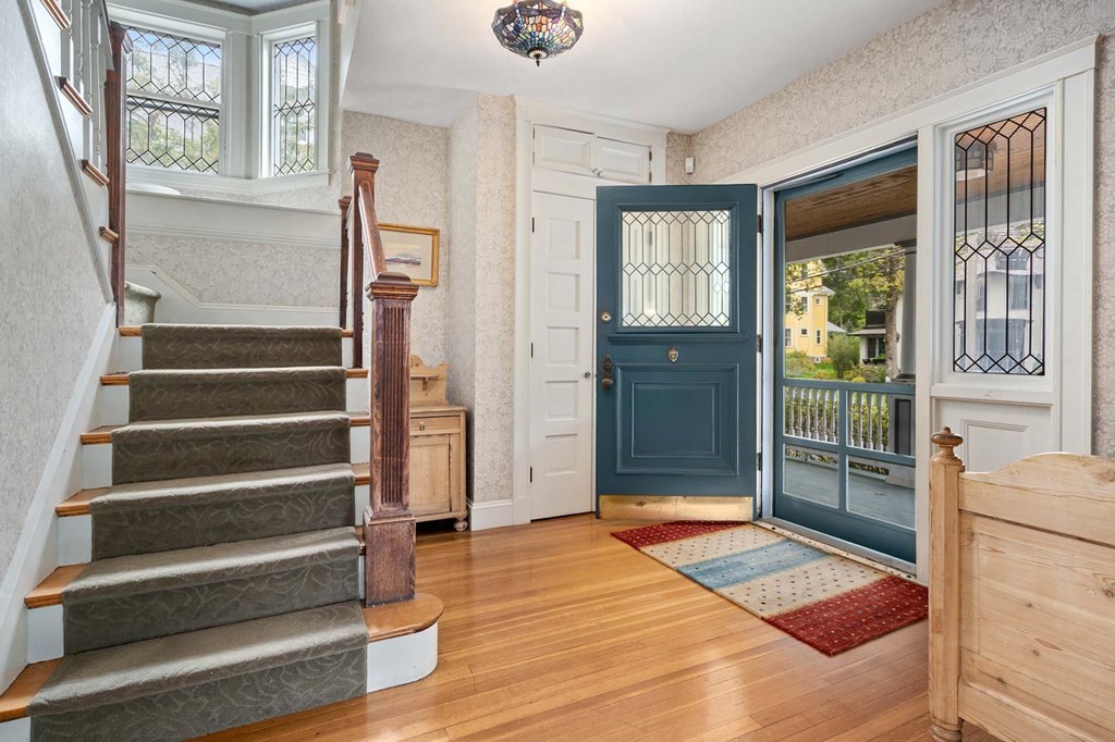 47 Stearns Street Newton, MA 02459 - Photo 4 of 32 a view of front door with wooden floor and windows
