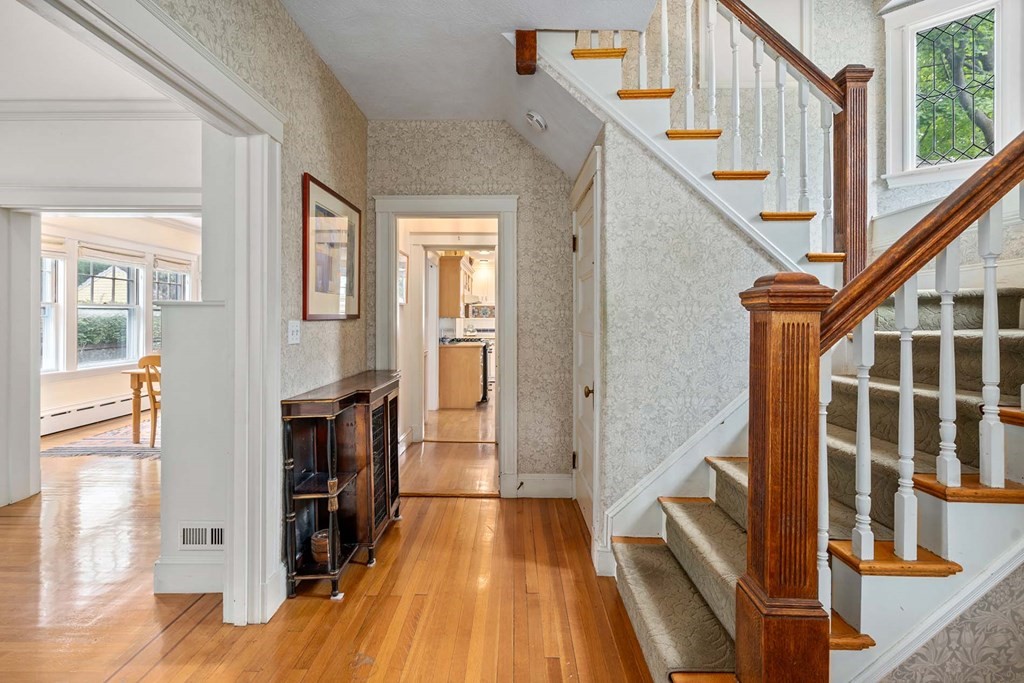 47 Stearns Street Newton, MA 02459 - Photo 5 of 32 a view of an entryway with wooden floor and staircase
