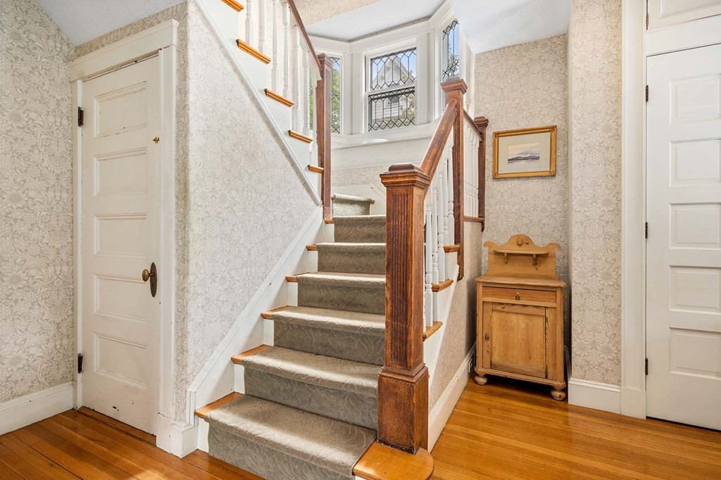 47 Stearns Street Newton, MA 02459 - Photo 6 of 32 a view of an entryway with wooden floor and staircase
