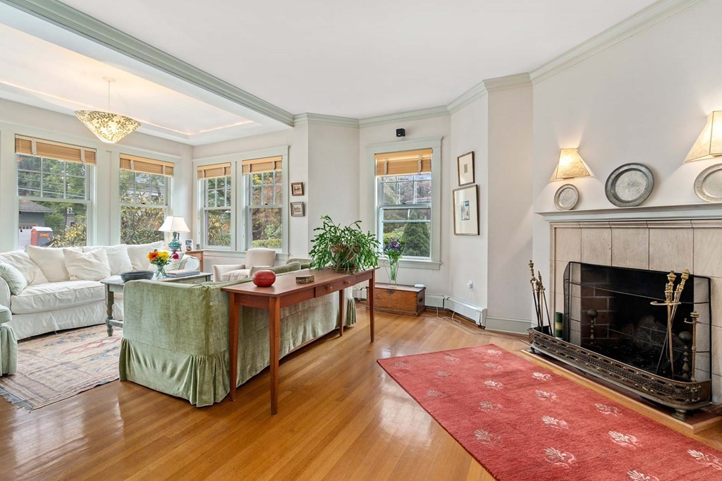 47 Stearns Street Newton, MA 02459 - Photo 7 of 32 a living room with furniture a window and a fireplace