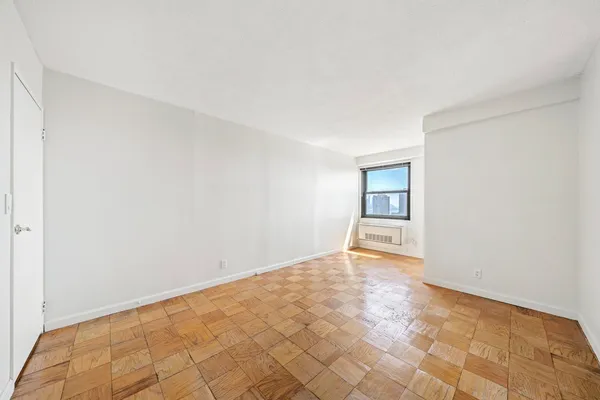 a room with gym equipment and a large window
