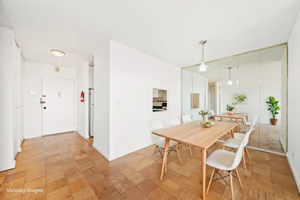 a kitchen with granite countertop a stove a sink and a refrigerator