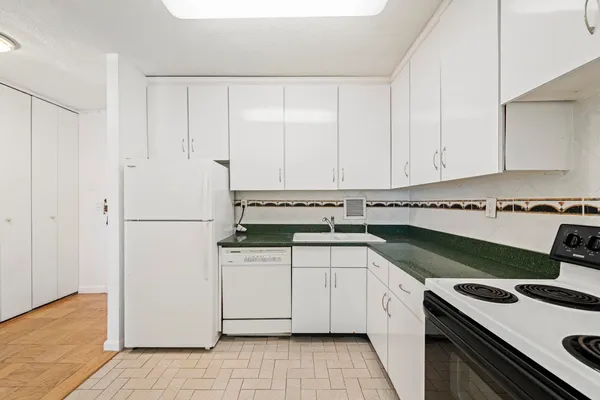 a bedroom with a large bed and a flat screen tv