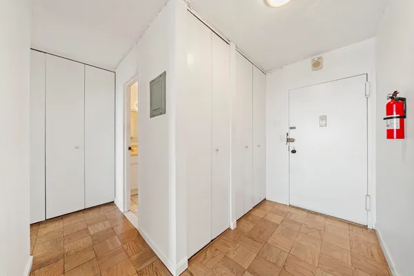 a view of an empty room and glass door