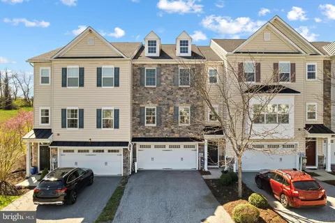 a view of multiple houses with a street