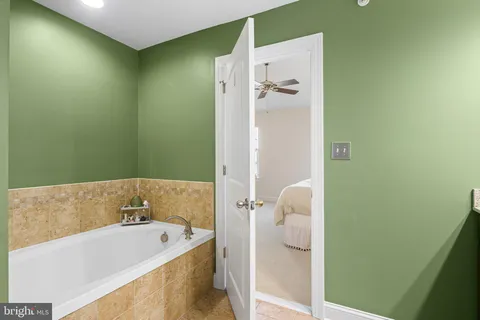 a bathroom with a tub and sink