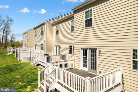 a view of a house with backyard and porch