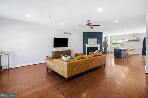 a living room with furniture fireplace and flat screen tv