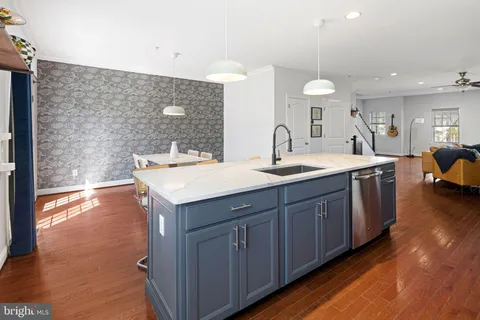 a bathroom with a sink double vanity granite and a large mirror