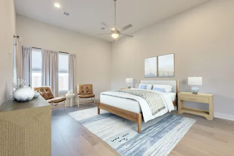 a bedroom with bed and a couch