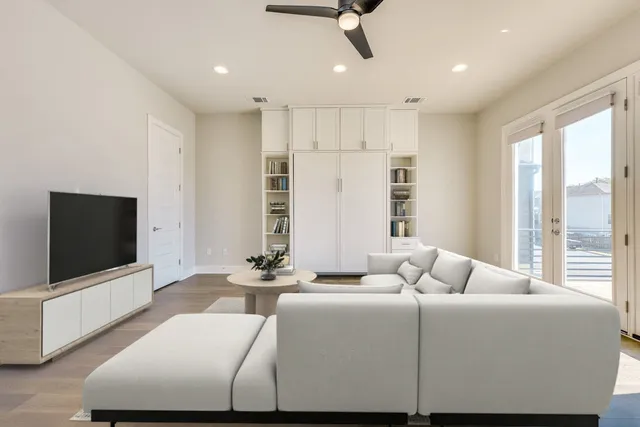 a bedroom with a bed and a potted plant