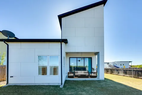 a view of a backyard with a table and chair