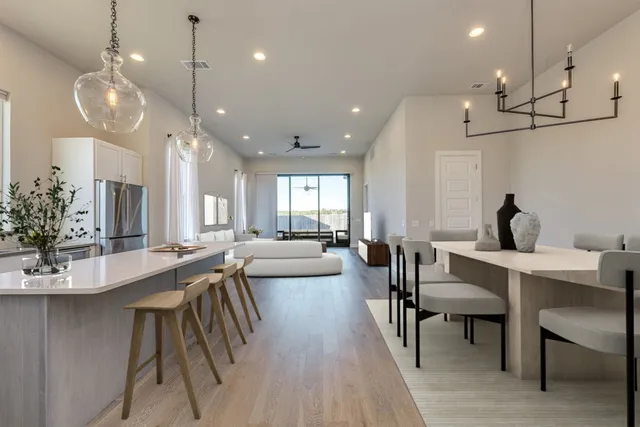 a kitchen with a sink cabinets and wooden floor