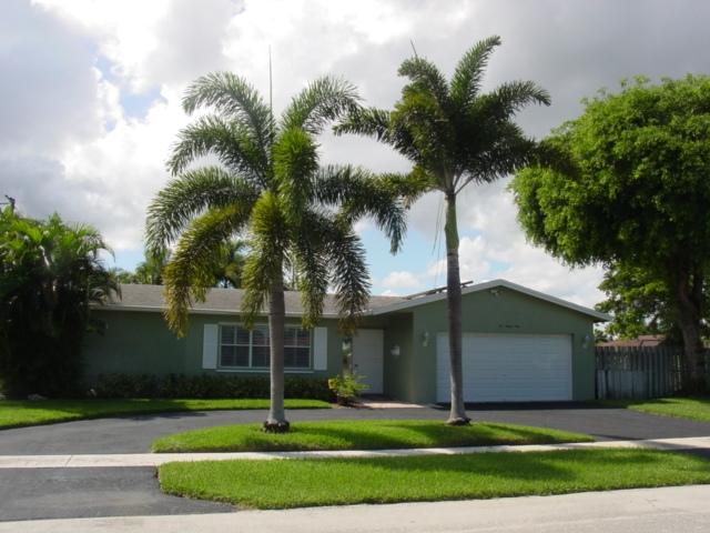 a house with tree in front of it