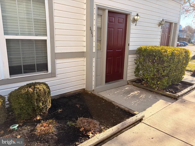 a bathroom with a black white checkered floor