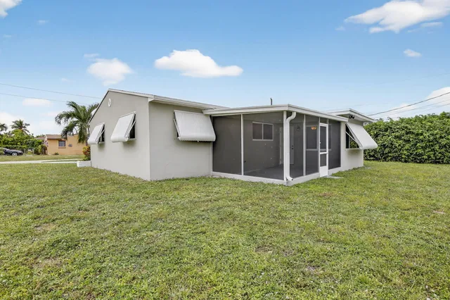 a view of a backyard of the house
