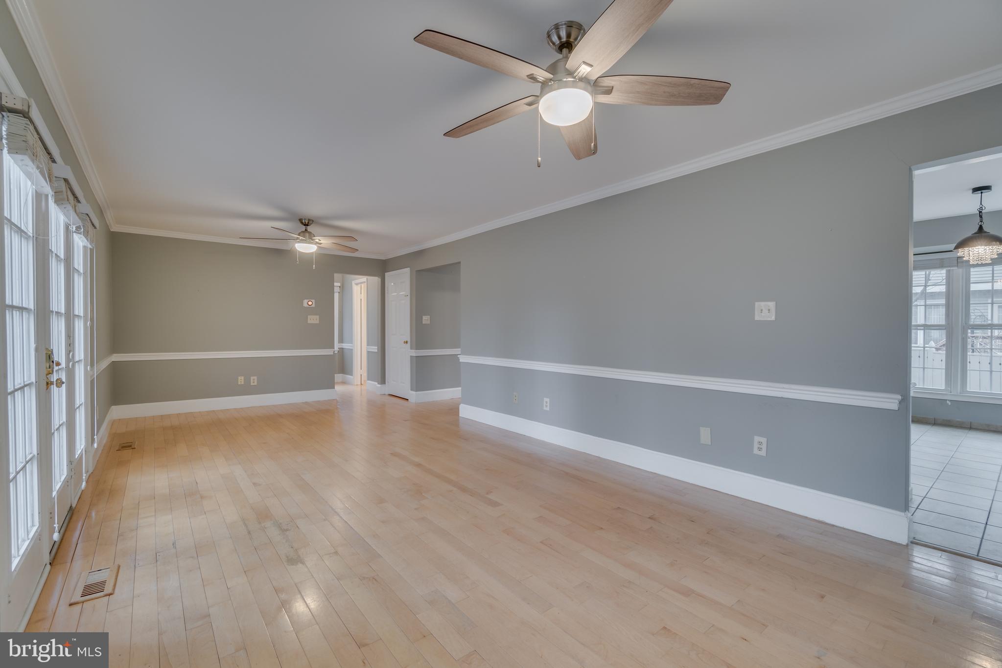 2069 Cobblestone Lane Reston, VA 20191 - Photo 4 of 35 wooden floor in an empty room with a window
