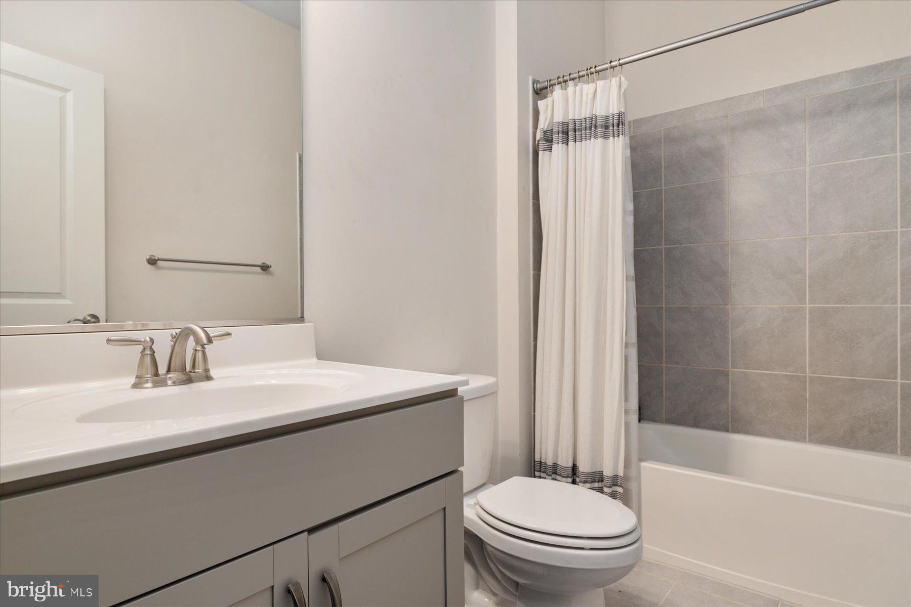 3351 Pitch Pine Drive Laurel, MD 20724 - Photo 15 of 43 a bathroom with a sink a toilet and shower