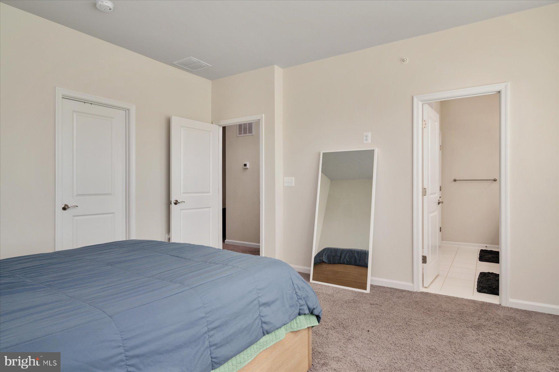 3351 Pitch Pine Drive Laurel, MD 20724 - Photo 18 of 43 a bedroom with a bed and a mirror