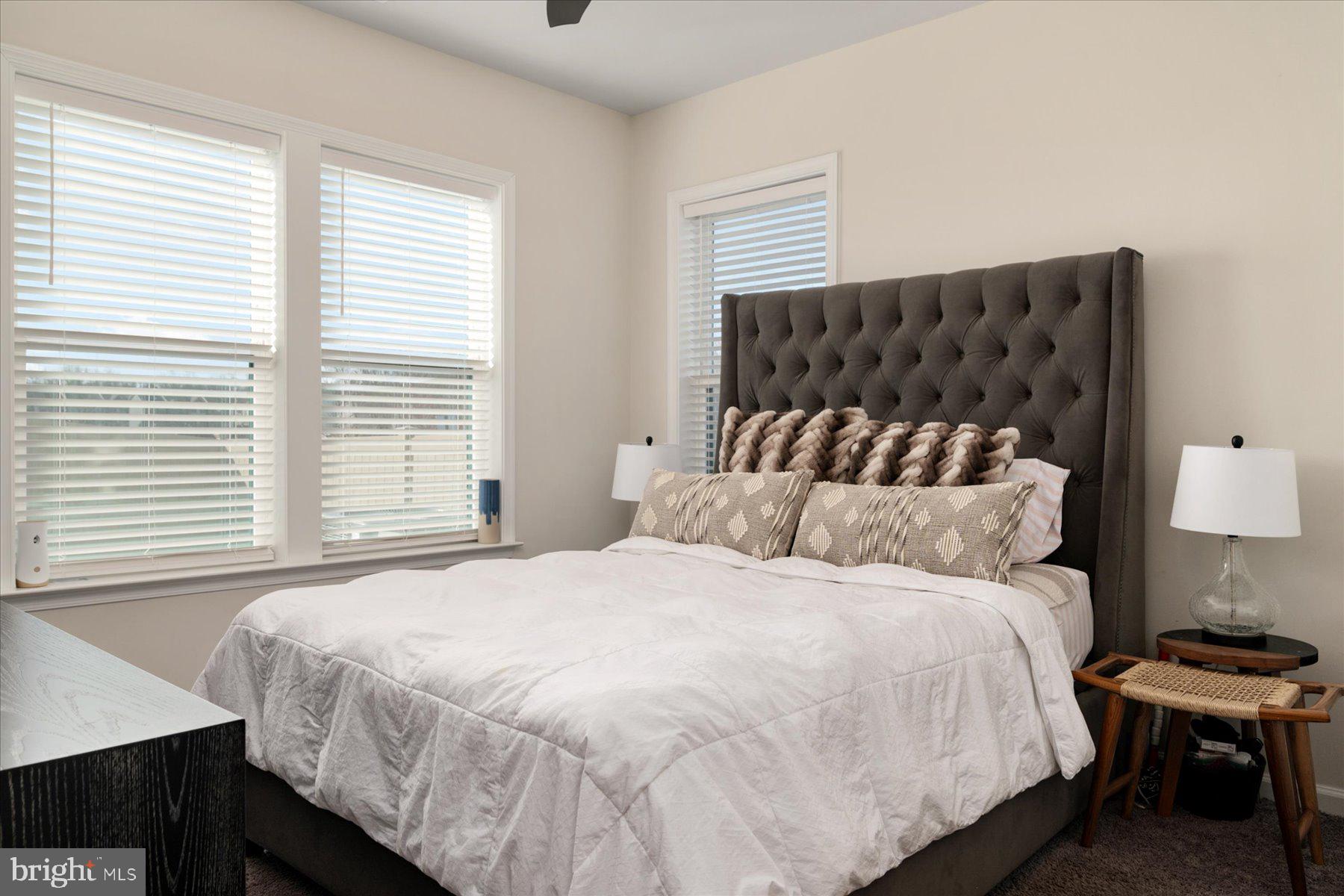 3351 Pitch Pine Drive Laurel, MD 20724 - Photo 26 of 43 a bedroom with a bed and a lamp