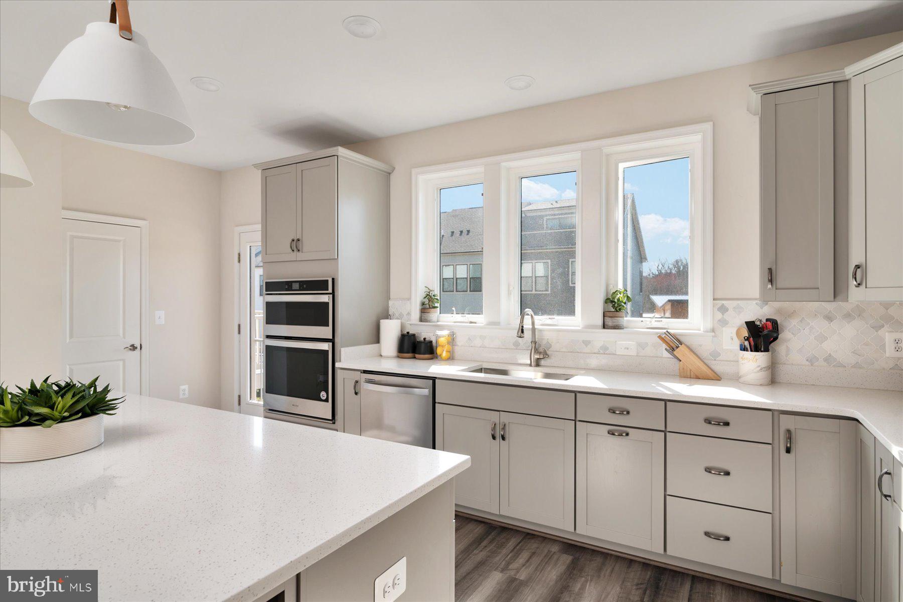 3351 Pitch Pine Drive Laurel, MD 20724 - Photo 5 of 43 a kitchen with a sink and cabinets