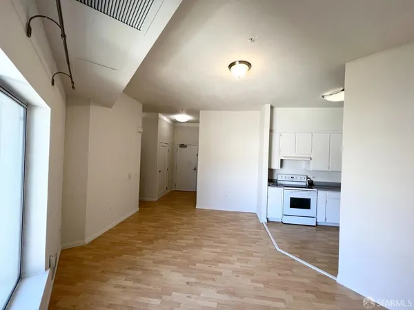 a view of a kitchen with a sink and dishwasher cabinets
