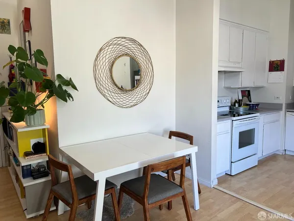 a view of kitchen with sink and wooden floor