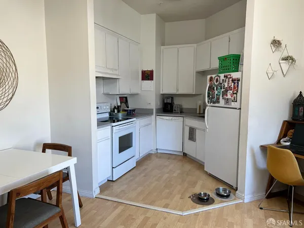 a kitchen with a stove a sink and a refrigerator
