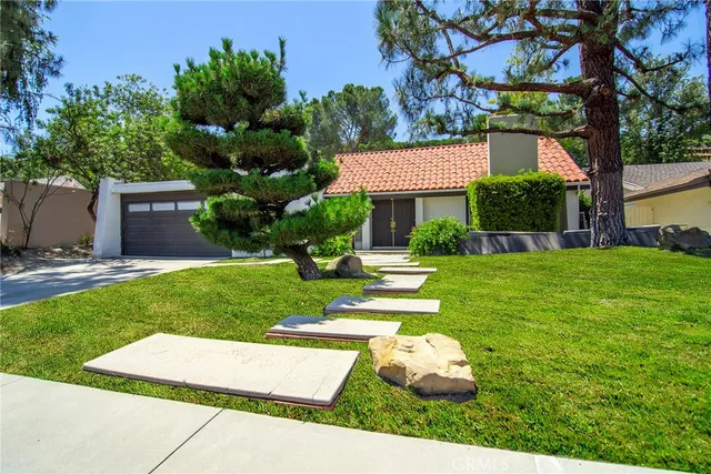 a house view with a garden space