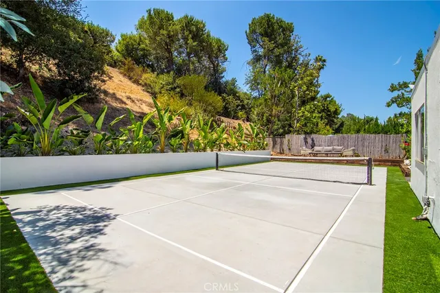 a view of swimming pool with a bench