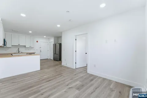 a view of kitchen with wooden floor