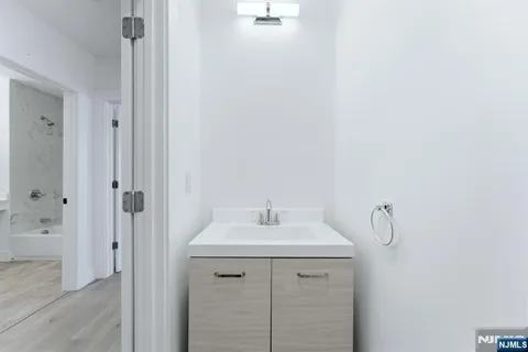 a bathroom with a sink and mirror