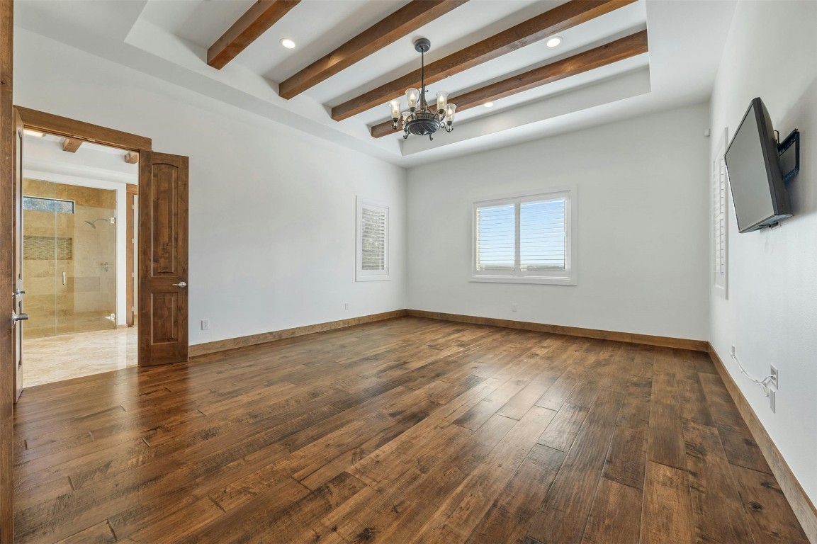 8040 Carlton Ridge Cove Austin, TX 78738 - Photo 15 of 40 a view of an empty room and wooden floor