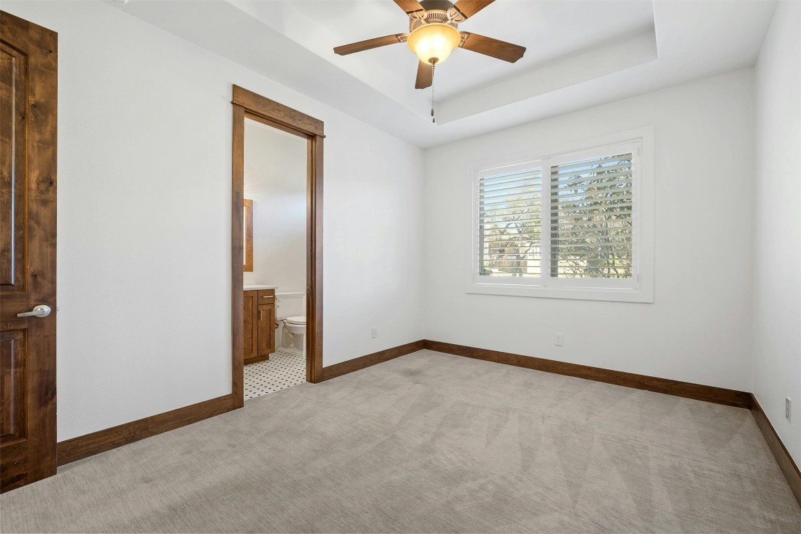 8040 Carlton Ridge Cove Austin, TX 78738 - Photo 21 of 40 an empty room with fan and windows